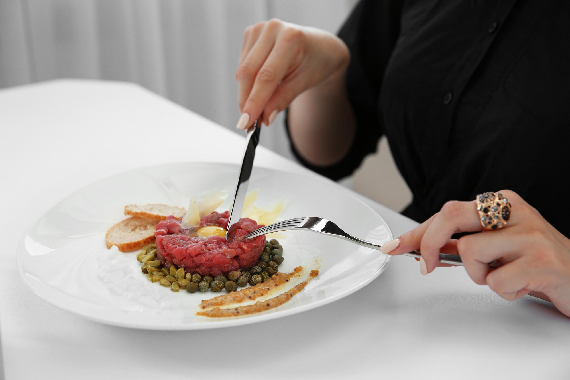 Chef plating dish during private dining